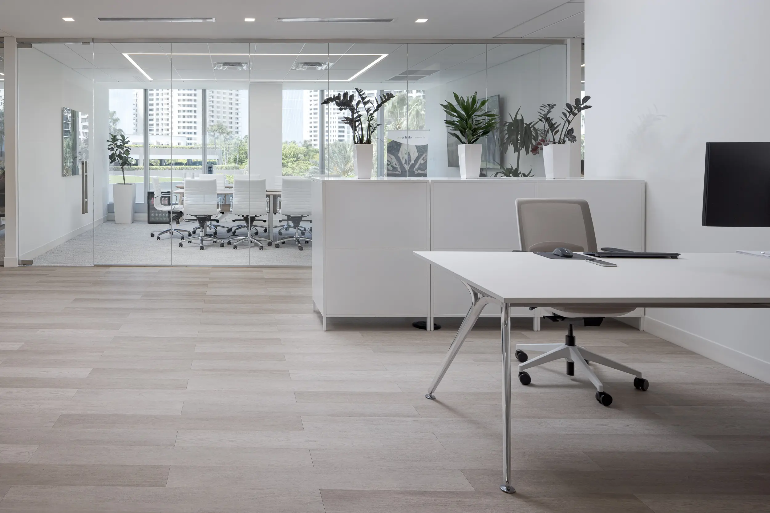 Enfinity Spec Suite open consulting space with sleek white finishes, built-in cabinetry, and natural light for a fresh clinical feel